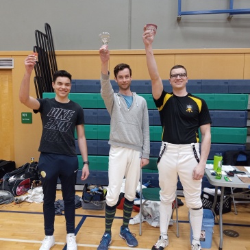 Epee medalists at 2022 Escrime Sundae tournament hold up their prize glasswear